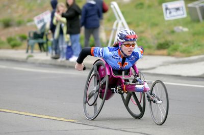 The Spokesman-Review Amanda McGrory crests Doomsday Hill en route to defending her Open Women’s title in the Wheelchair Division. (Jesse Tinsley / The Spokesman-Review)