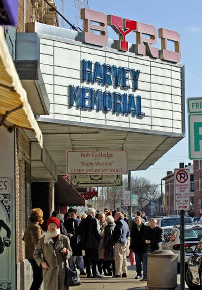 
A crowd gathers in front of the Byrd Theatre in Richmond, Va., prior to a memorial service for the Harvey family Saturday. The family of four was found slain in their Richmond home on Jan. 1. 
 (Associated Press / The Spokesman-Review)