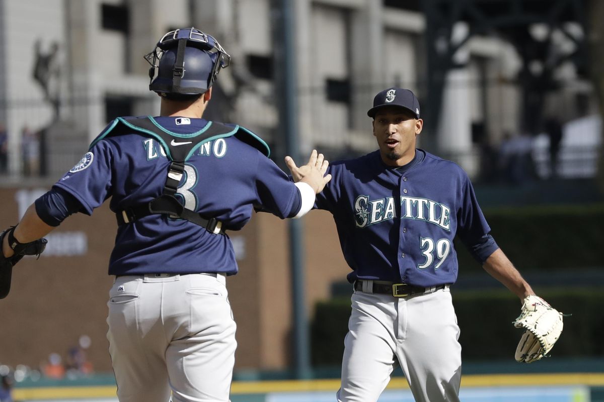 Seattle Mariners relief pitcher Edwin Diaz, right, greets catcher Mike Zunino after the last out in the ninth inning of a baseball game against the Detroit Tigers, Thursday, April 27,2017, in Detroit. The Mariners won 2-1. (Carlos Osorio / Associated Press)