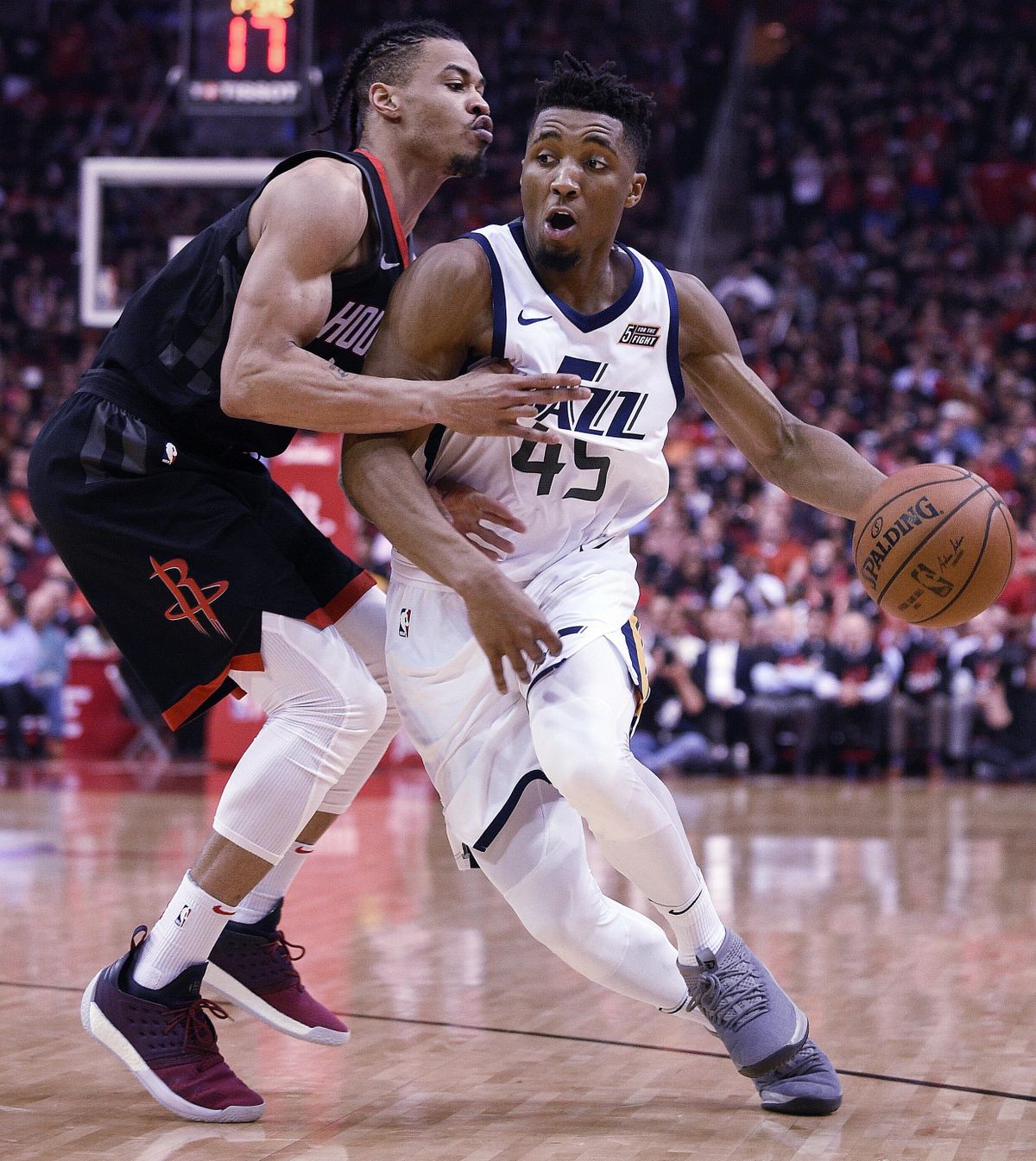 Utah Jazz guard Donovan Mitchell, right, dribbles as Houston Rockets guard Gerald Green defends during the second half in Game 5 of an NBA basketball second-round playoff series, Tuesday, May 8, 2018, in Houston. (Eric Christian Smith / Associated Press)