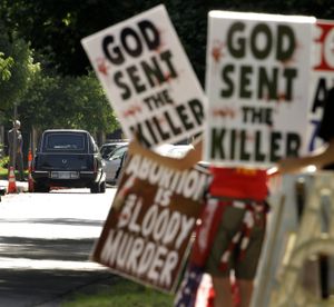 Protesters from the Rev. Fred Phelps’ Westboro Baptist Church demonstrate during funeral services for Dr. George Tiller  in Wichita, Kan., on Saturday.  (Associated Press / The Spokesman-Review)