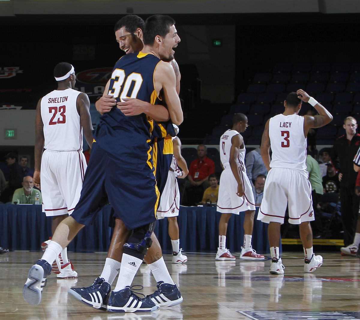 David Chavarria (30) and Kevin Bradshaw celebrate after beating the Cougars. (Associated Press)