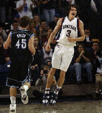 Adam Morrison is pleased about hitting a first-half 3-pointer. Morrison scored 24 points. 
 (Brian Plonka / The Spokesman-Review)