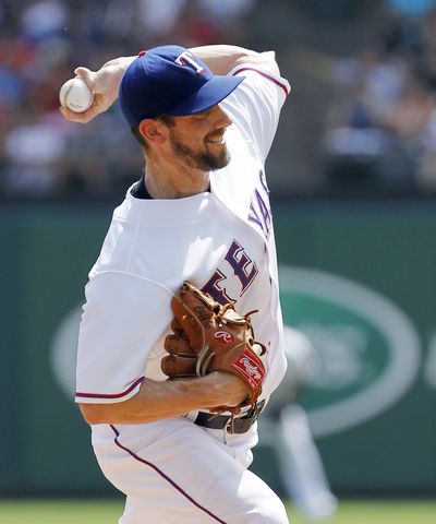 Texas Rangers starter Cliff Lee throws a pitch during a baseball game against the New York Yankees on Sunday, Sept. 12, 2010, in Arlington, Texas. (Brandon Wade / Fr168019 Ap)