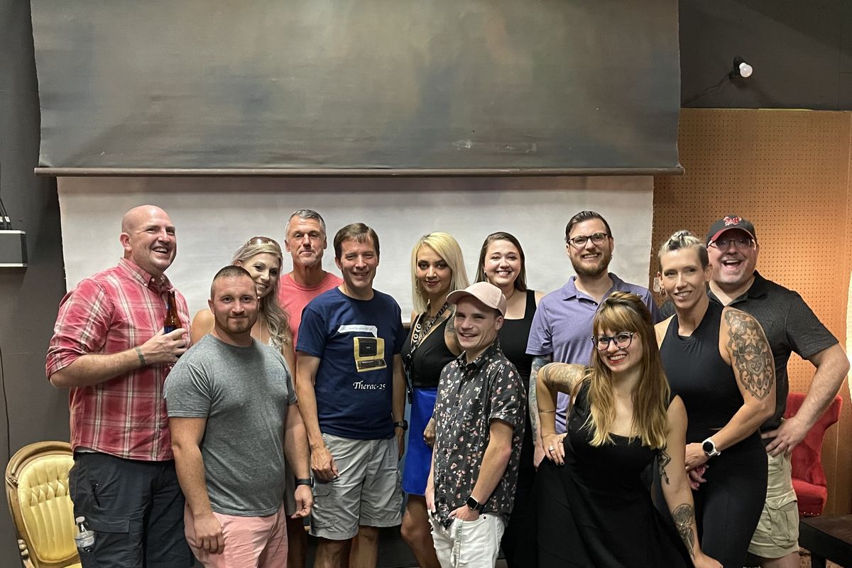 The third annual Same Dress Spokane photographers and models gather Saturday to compare notes and celebrate the completion of the 12-week photography project. Pictured are, from left: Mike Wolfgram, Gavin James, Lisa Pipella, Jason Jakober, Scott Martinez, model Jaden Stevens, Tabor Cote, Rachel Fellows, Chris Wooley, model Nicole Brianna, model Amber Blackstock and John Austin. (Courtesy of Becky Martinez)