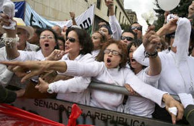 
Marchers shout Thursday in Cali, Colombia, demanding the release of kidnap victims.Associated Press
 (Associated Press / The Spokesman-Review)