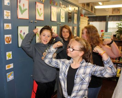 Brooklyn Bailey, left, and Madyson Doolittle-Brown doing some of the welcome exercises in their fifth-grade classroom at West Intermediate School in Sutherlin, Ore. on May 11. Their fifth-grade class is just one of the classes in Sutherlin that uses a program called Conscious Discipline Building Resilient Children. Exercises and music are used to get students focused and excited about the day. (Dan Bain / AP)