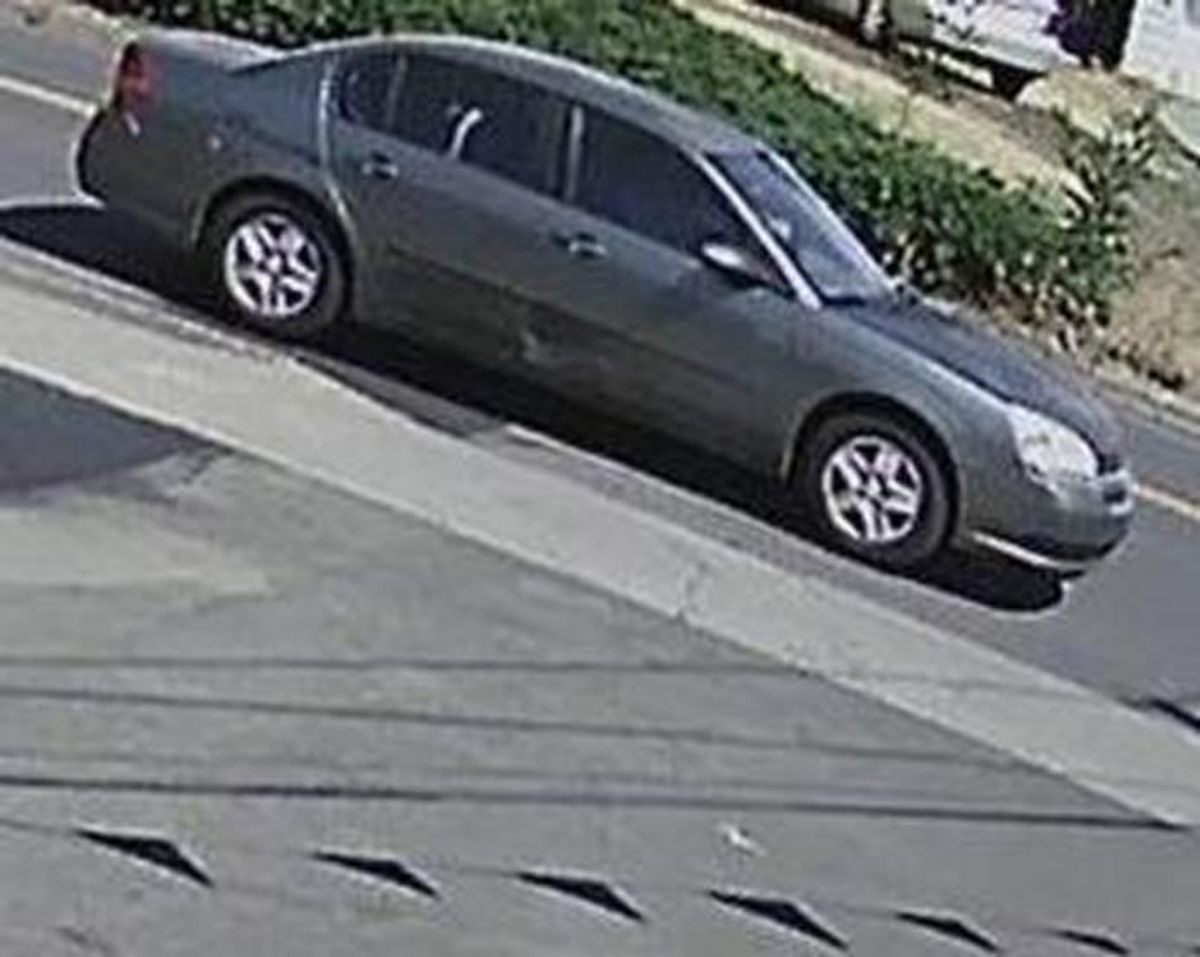 A vehicle believed to have been used by the so-called “Double Hat Bandit.” The car is described as a “greyish-blue Chevy Malibu” or similar vehicle. (FBI)