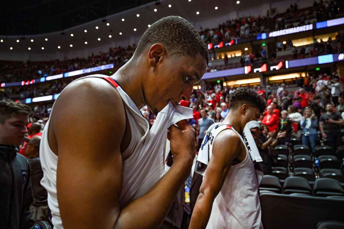 Gonzaga guard Zach Norvell Jr. (in front ) and Gonzaga forward Rui Hachimura (21) leave the court after Texas tech defeated the Zags  in the NCAA West Regional Final college men