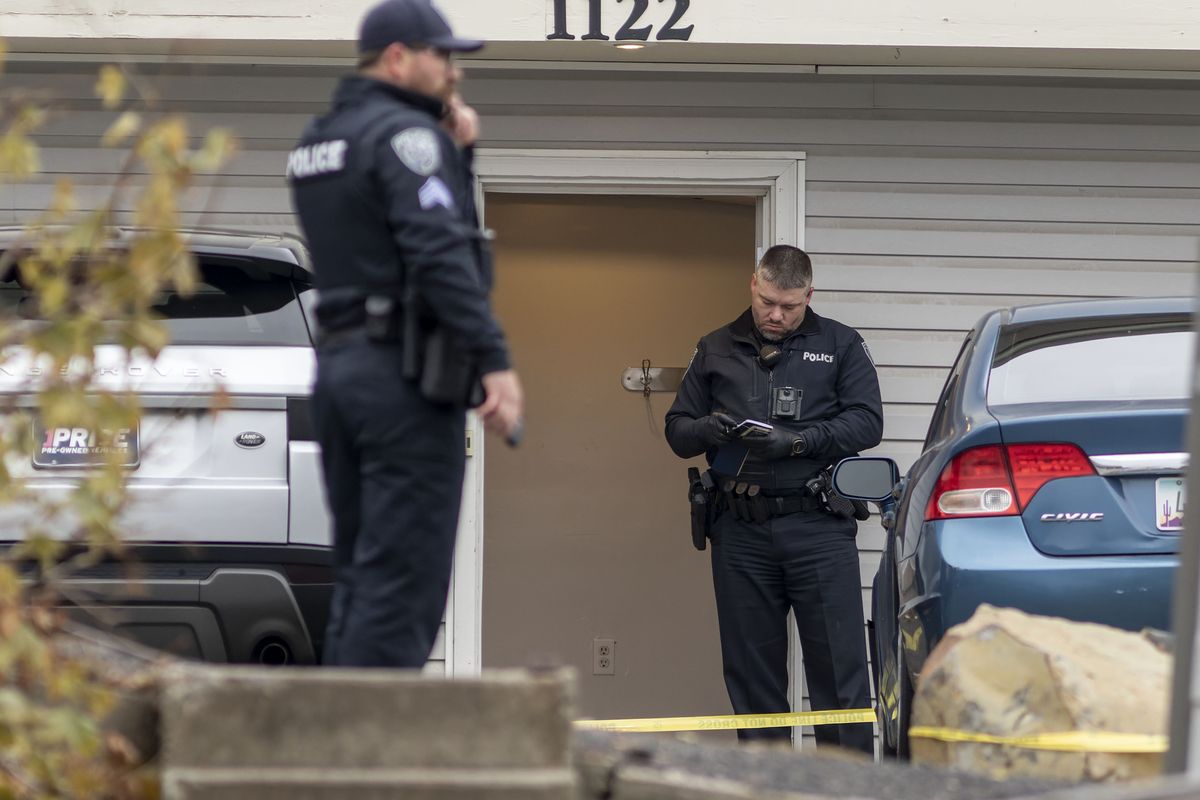 Moscow police officers work outside a house at 1122 King Road during a homicide investigation on Sunday, Nov. 13, 2022, in Moscow. Police Capt. Tyson Berrett said police don