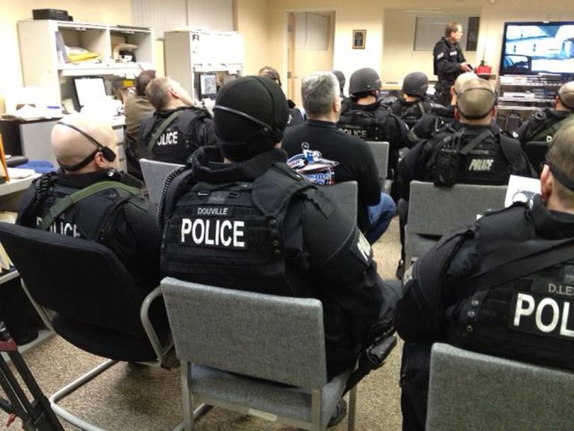 The Spokane police SWAT team prepares for a drug raid at a home in the 2800 block of East Fourth Avenue on Feb. 29. (Spokane Police Department)