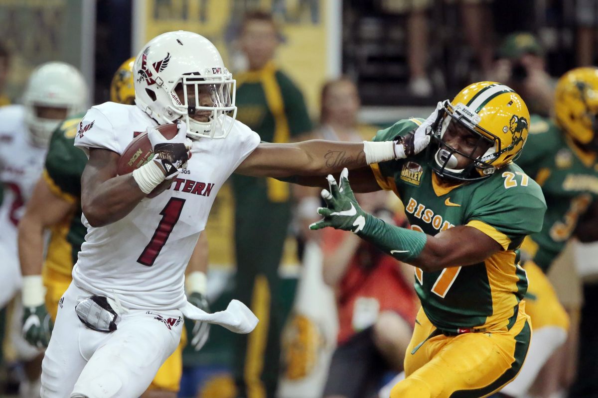 Shaq Hill of Eastern Washington tries to avoid Isaac Cenescar of North Dakota State University during the Saturday game at the Fargodome. NDSU won 50-44. (Dave Wallis / The Forum)