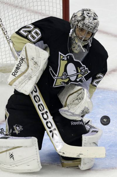 Penguins goalie Marc-Andre Fleury deflected 36 shots to help Pittsburgh to its seventh win overall and fifth straight win at home. (Associated Press)
