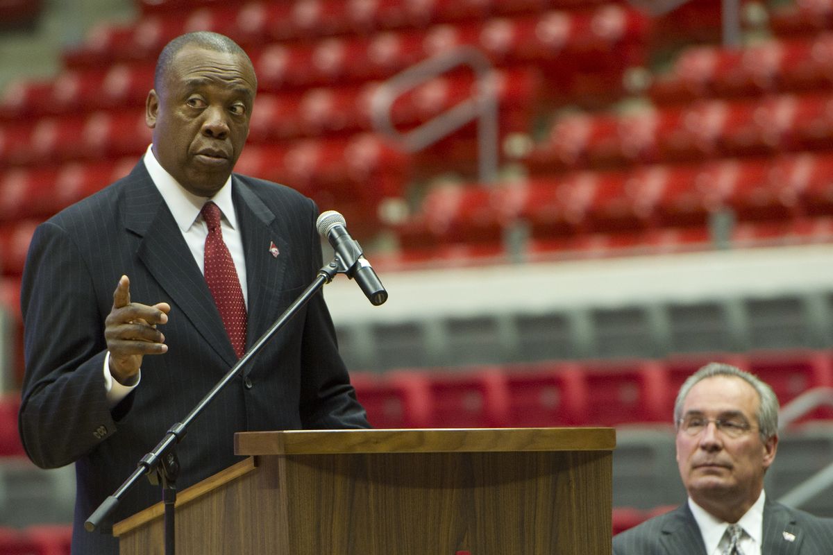 WSU A.D. Bill Moos, right, listens to one of his newest hires, basketball coach Ernie Kent, during his introductory press conference. (Tyler Tjomsland)