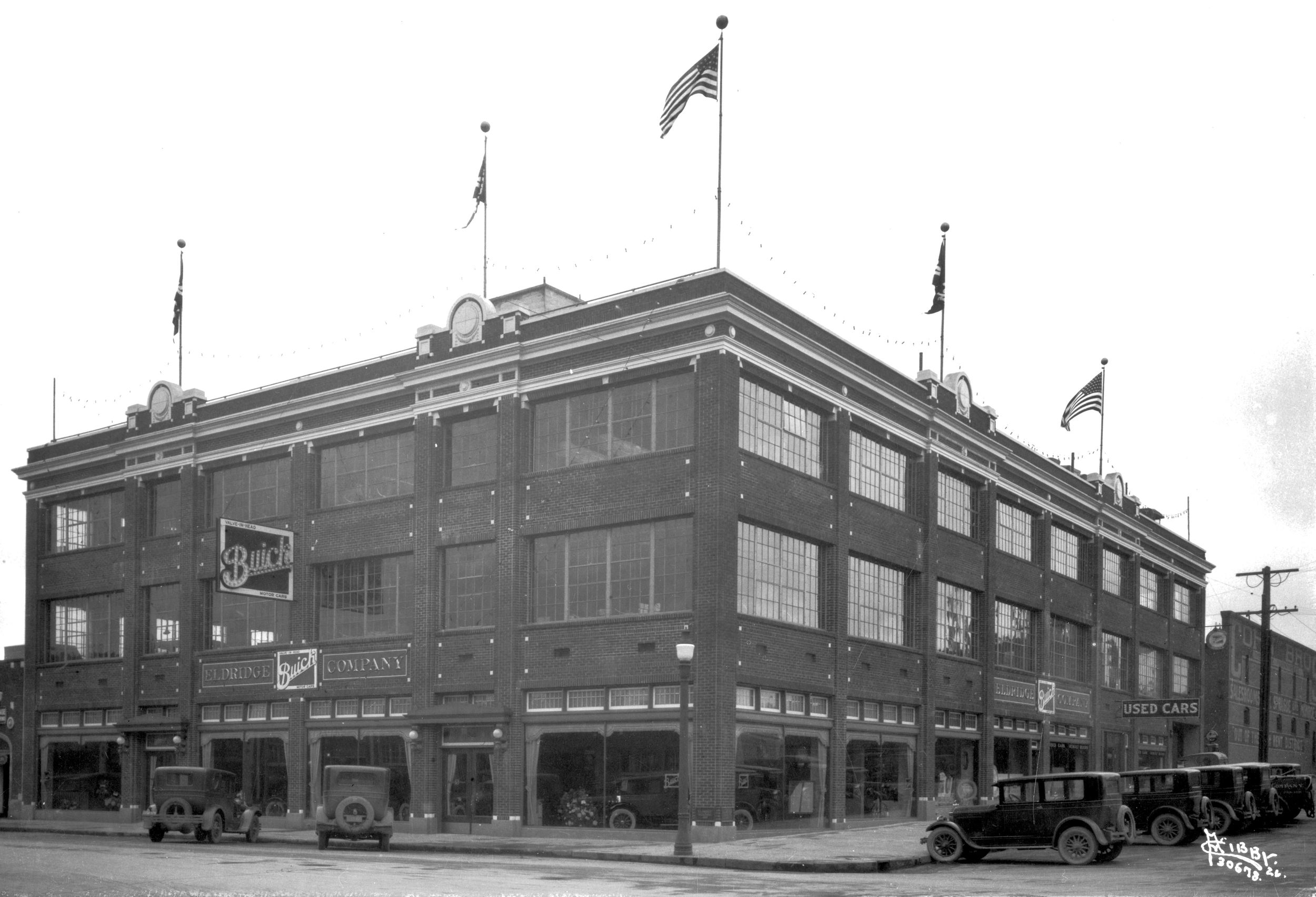1926: The Eldridge Building, built for the Eldridge Buick Co., sits on the southeast corner of First Avenue and Cedar Street on the west end of downtown Spokane. The three-story building had an elevator to raise autos to any level of the building, including the roof. The architecture is typical of early automotive manufacturing, sales and service centers from that era. (The Eastern / The Spokesman-Review)
