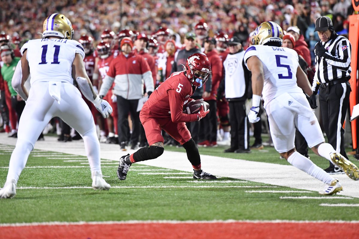 Washington State receiver Lincoln Victor looks for running room against the Washington Huskies during the 2022 Apple Cup.  (Tyler Tjomsland/The Spokesman-Review)