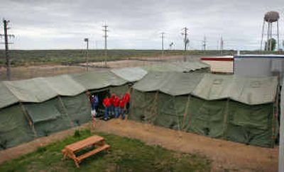 Portable tents sit under a cloudy sky at the Southern Idaho Correctional Institution on Wednesday. The tents are being used to help alleviate overcrowding at the facility.
(The Spokesman-Review)
