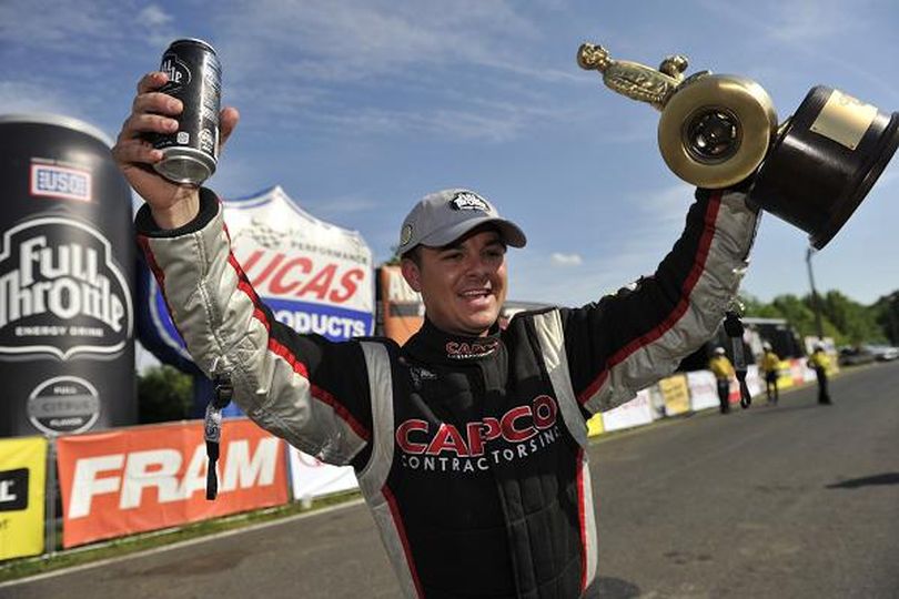 Steve Torrence celebrates his NHRA Full Throttle Drag Racing Series Top Fule victory at Englishtown. (Photo courtesy of NHRA Media Relations)