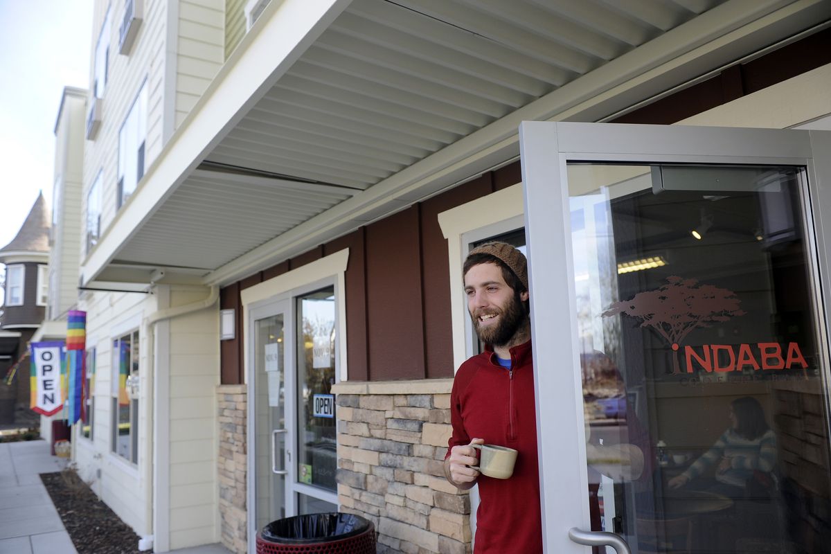 Abe Henderson manages the new Indaba Coffee Bar in the Walnut Corners project, an affordable housing complex on Broadway in Spokane. (Jesse Tinsley / The Spokesman-Review)