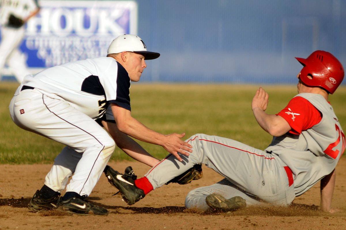 Mead shortstop Skyler Lookabill tags out Ferris’ Cody Sorenson during a steal attempt  in the sixth inning. (Colin Mulvany)