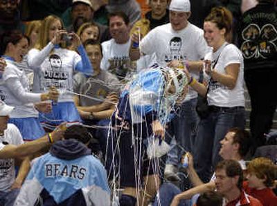 
After winning the 125-pound state wrestling championship, Lucas Chesher of Central Valley is greeted by a silly string attack. His friends all wear T-shirts with his face on them made by his sister, Casey, top right. Chesher beat Jarrett Tomalin of Kentwood Saturday in the Tacoma Dome. 
 (Christopher Anderson photos/ / The Spokesman-Review)