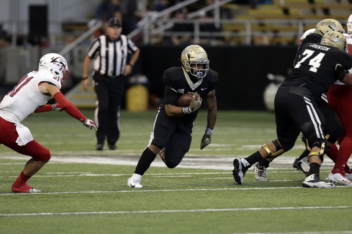 Idaho running back Isaiah Saunders finds a hole  against Southern Utah during an  Oct. 20 game  in Moscow, Idaho. (Kai Eiselein / AP)