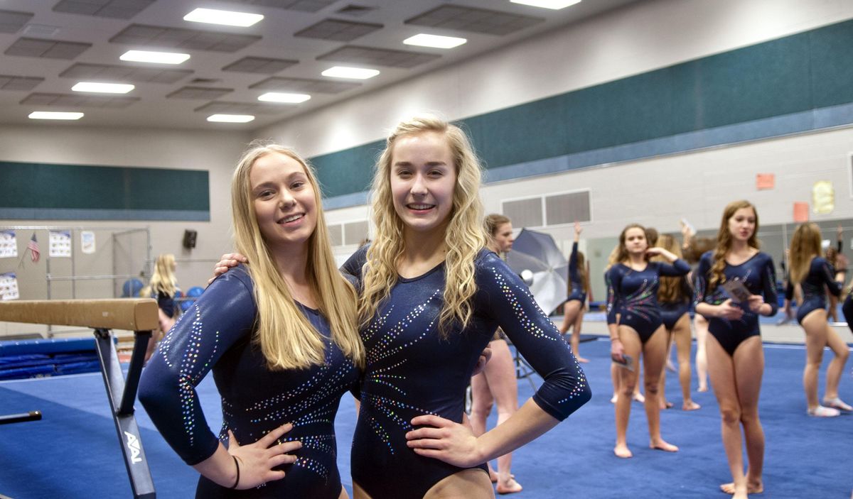 Central Valley High School gymnasts Victoria Axtell, left and Rebekah Ross pose for a photograph before practice on Monday, Jan. 27, 2020. (Kathy Plonka / The Spokesman-Review)