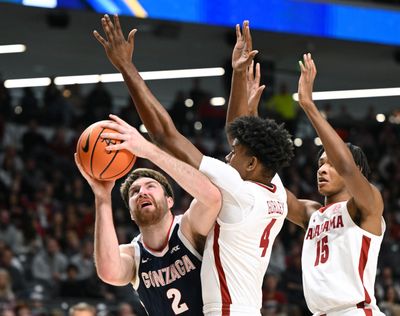 Gonzaga forward Drew Timme (2) looks to the basket as Alabama forward Noah Gurley (4) and forward Noah Clowney (15) defend during the first half of a NCAA college basketball game, Saturday, Dec.17, 2022, in Birmingham, Alabama.  (Colin Mulvany / The Spokesman-Review)