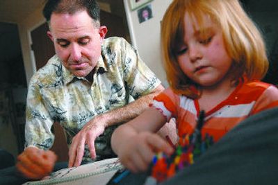 
Bill Schumacher, who has struggled with anorexia and bulimia, colors a picture in a coloring book with his daughter Lindsay, 5. 
 (Photos by Holly Pickett / The Spokesman-Review)