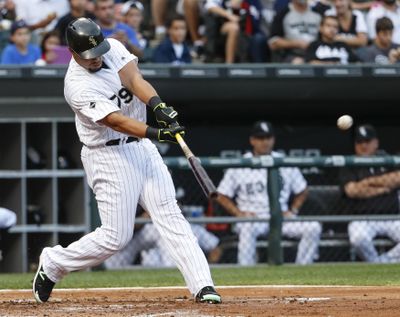 Jose Abreu of the Chicago White Sox hits a home run off Seattle’s Ariel Miranda during the first inning Saturday in Chicago. (Kamil Krzaczynski / Associated Press)