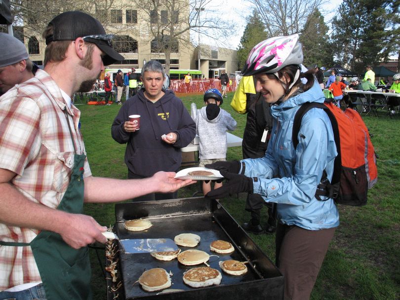 A free commuter's breakfast in Riverfront Park has become a popular start to the annual Bike to Work activities in Spokane each May. (Rich Landers)