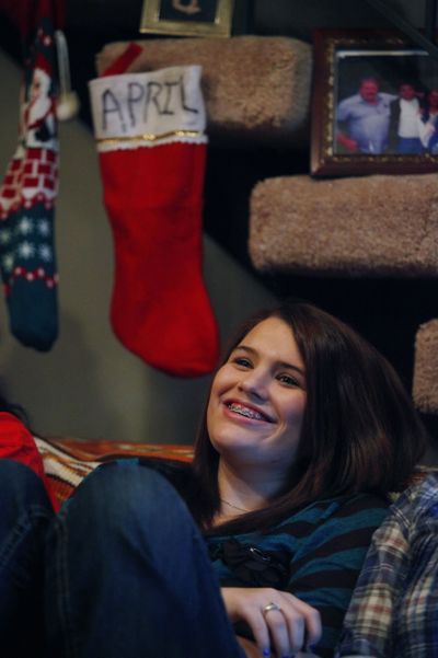 April Lutz, 15, sits at her family’s home in Monroe, Wash., on Thursday. Less than two months ago, April was stabbed in a bathroom at Snohomish High School. (Associated Press)