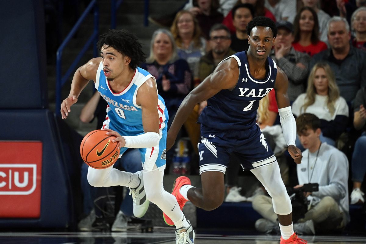 Gonzaga guard Ryan Nembhard (0) heads downcourt as Yale guard Bez Mbeng (2) gives chase during the first half of a NCAA college basketball game , Friday, Nov. 10, 2023, in the McCarthey Athletic Center.  (COLIN MULVANY/THE SPOKESMAN-REVIEW)