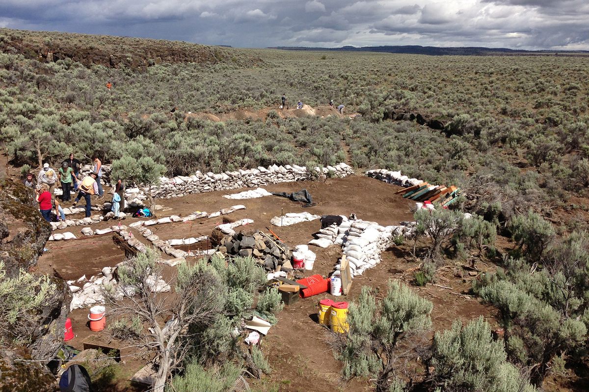 This 2013 photo provided by the University of Oregon Museum of Natural and Cultural History shows the Rimrock Draw Rockshelter archaelogical dig outside Riley, Ore. Archaeologists have uncovered a stone tool at the ancient rock shelter that could turn out to be older than any known site of human occupation in western North America. The find was announced Thursday by the U.S. Bureau of Land Management. (Associated Press)