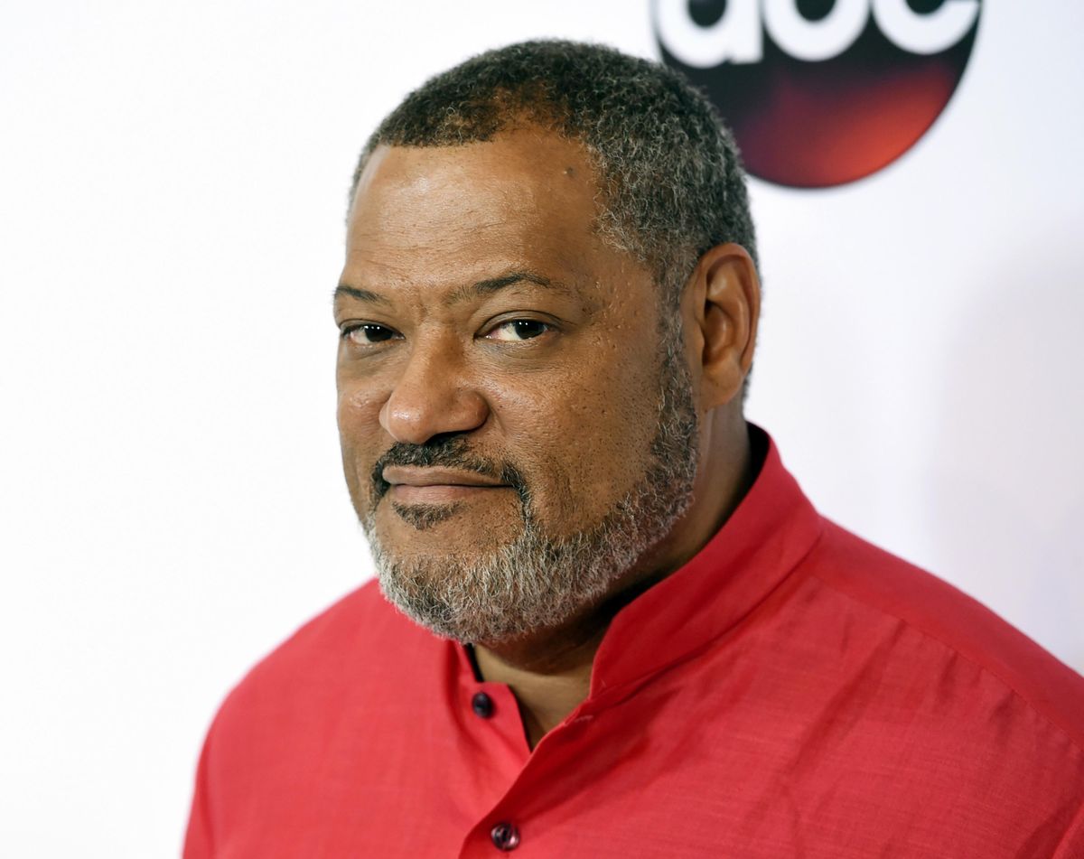 FILE - In this Aug. 4, 2015 file photo, actor Laurence Fishburne poses at the Disney ABC Television Group party during the 2015 Television Critics Association Summer Press Tour in Beverly Hills, Calif. Fishburne and Joe Mantegna are set to host the Memorial Day concert in Washington. The 28th annual concert from the West Lawn of the U.S. Capitol will be broadcast nationwide at 8 p.m. Sunday on PBS. (Photo by Chris Pizzello/Invision/AP, File) ORG XMIT: NYET520 (Chris Pizzello / Chris Pizzello/Invision/AP)