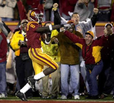 
Southern California's Dwayne Jarrett reacts as he scores his second touchdown on a 57-yard pass from Matt Leinart in USC's win over Notre Dame.
 (Associated Press / The Spokesman-Review)