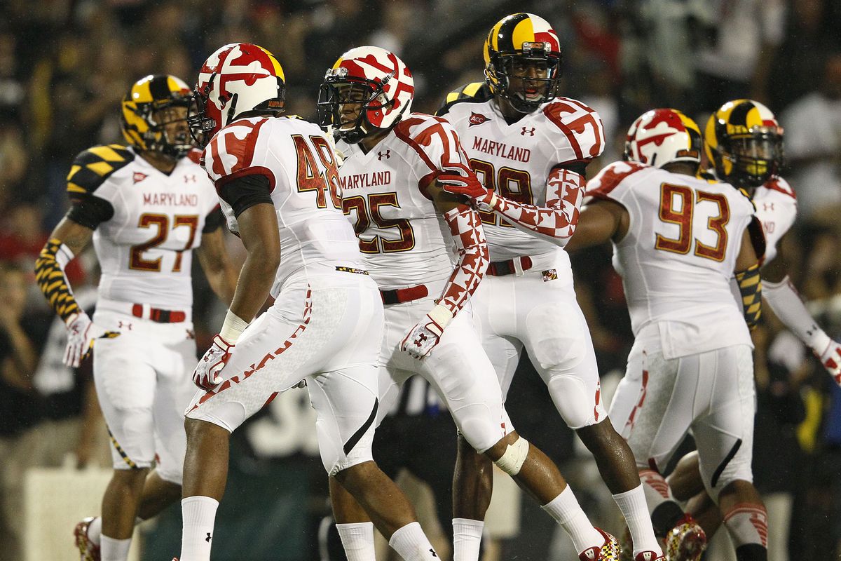 In this photo taken Sept. 5, 2011, members of the Maryland football team transition during a change of possession in the first half of an NCAA football game against Miami in College Park, Md. (Patrick Semansky / Associated Press)