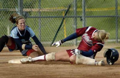 
Central Valley third baseman Ashley Mayhle tags Mt Spokane's Angel Urann out during the top of the second inning. Mt. Spokane earned its first regional berth with a 3-1 victory.
 (Colin Mulvany / The Spokesman-Review)