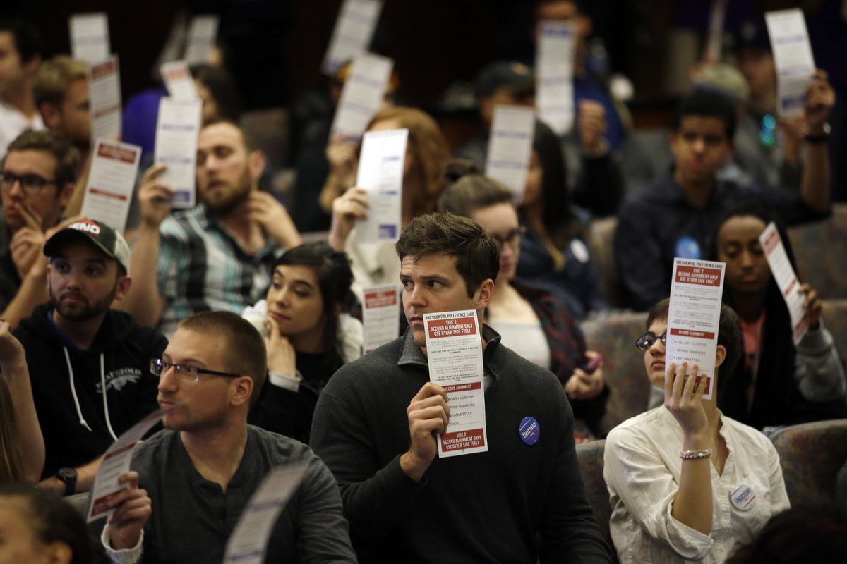 Presidential preferences cards are held up as votes are counted during a Democratic caucus at the University of Nevada Saturday, Feb. 20, 2016, in Reno, Nev. (Marcio Jose Sanchez / Associated Press)