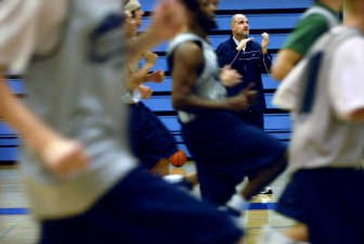 
First-year coach Mike Burns, background, brings vigor to a veteran Community Colleges of Spokane men's basketball team. 
 (Holly Pickett / The Spokesman-Review)