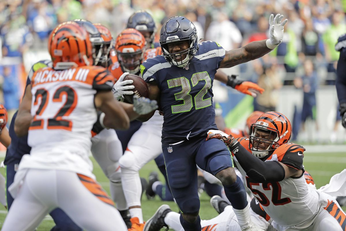 Seattle Seahawks running back Chris Carson (32) rushes against the Cincinnati Bengals during the second half of an NFL football game, Sunday, Sept. 8, 2019, in Seattle. (John Froschauer / Associated Press)
