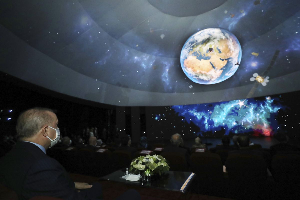 Turkish President Recep Tayyip Erdogan speaks in Ankara, Turkey, late Tuesday, Feb. 9, 2021. Erdogan unveiled Tuesday an ambitious 10-year space program for his country, including missions to the moon, sending Turkish astronauts into space and developing internationally-competent satellite systems.  (POOL)