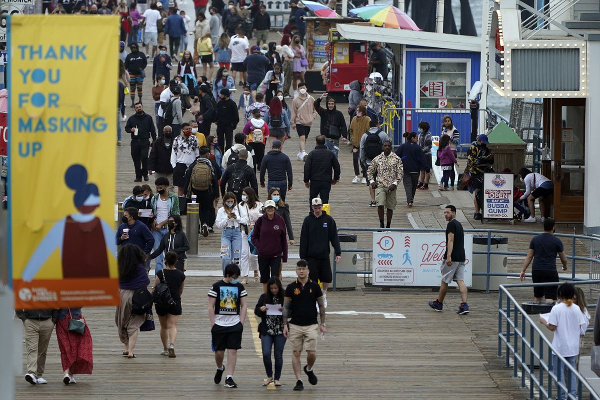 FILE - In this Thursday, May 13, 2021, file photo, a posted sign thanks visitors for wearing masks in Santa Monica, Calif. California