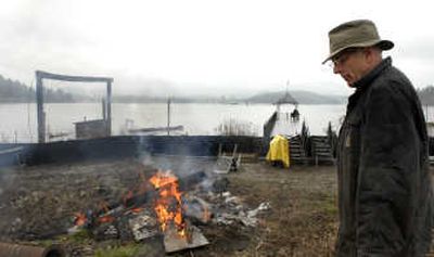 
Sheriff Rocky Watson gives a tour of property where he plans to locate a 1932 log house.
 (Kathy Plonka / The Spokesman-Review)