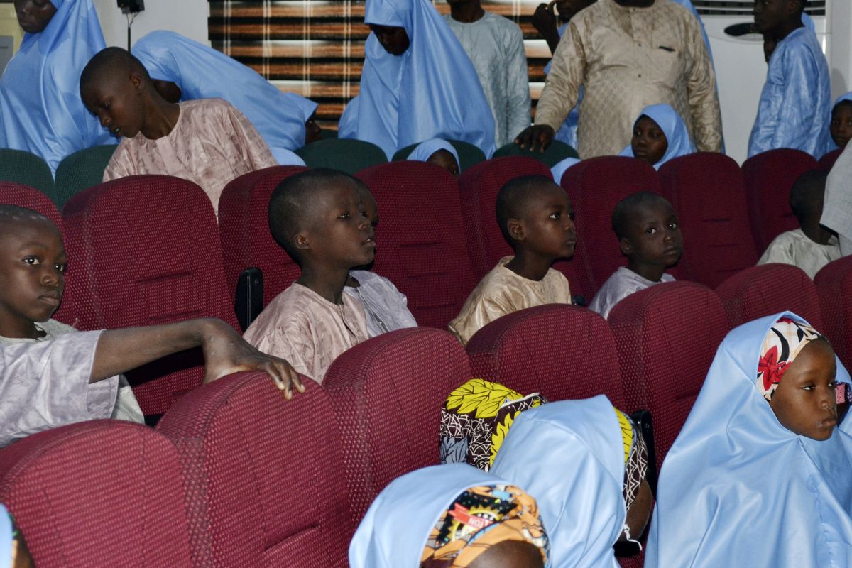 Some freed students from the Salihu Tanko Islamic School are reunited with their parents in Minna, Nigeria, Friday, Aug. 27, 2021. A school official in northern Nigeria says gunmen have released some of the more than 100 children who had been abducted back in May. The kidnapping victims from the Salihu Tanko Islamic School in Niger state had included children as young as 5 years old.  (AP Photo)