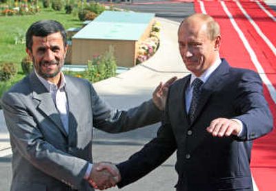
Iranian President Mahmoud Ahmadinejad greets Vladimir Putin on Tuesday at the start of a closely watched visit by the Russian president to  Tehran. Associated Press
 (Associated Press / The Spokesman-Review)
