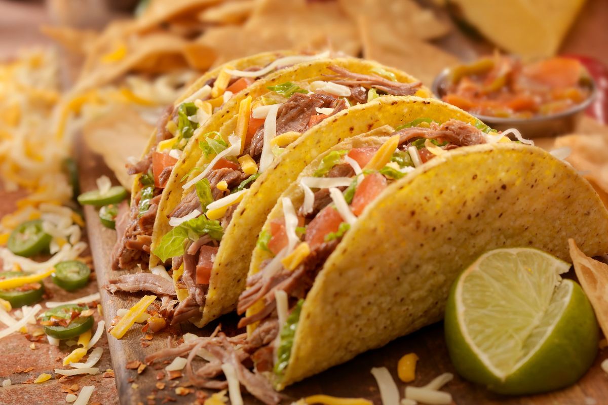 Hard tacos with shredded beef, lettuce, tomato, onions and cheese. (Lauri Patterson)