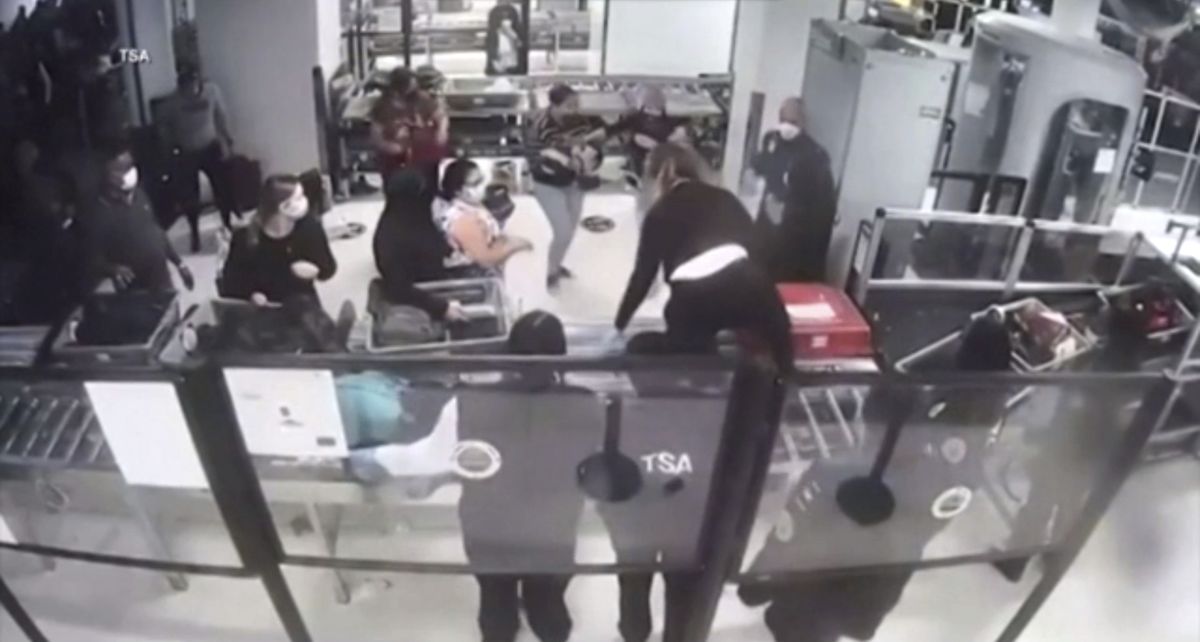 Transportation Security Administration (TSA) officer Cecilia Morales jumps over a conveyor belt at security checkpoint to assist mother with unresponsive baby, performing life saving maneuver on Dec. 9, 2021 at Newark Liberty International Airport in Newark, N.J. Morales, an EMT who has been a TSA officer for about two months, told the agency she performed the infant version of the Heimlich maneuver. (HOGP)