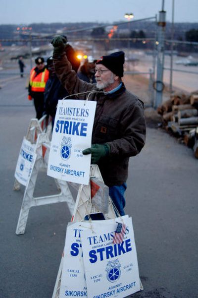 
Cancer patient Michael Blake is among strikers at Sikorsky Aircraft in Stratford, Conn. The striking workers, who normally make about $25 an hour, receive strike pay of $220 a week, union officials said.
 (Associated Press / The Spokesman-Review)