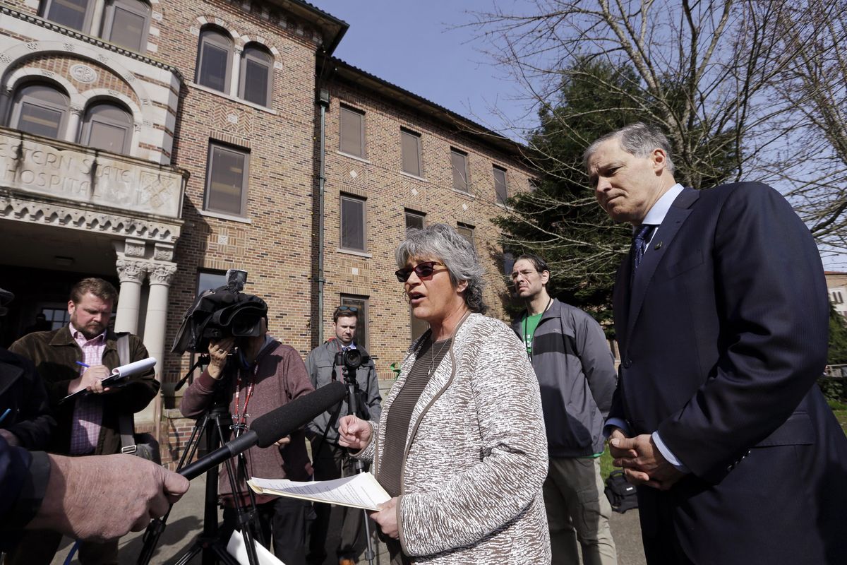 In this file photo taken April 11, 2017, Western State Hospital CEO Cheryl Strange addresses members of the media in front of the facility as Gov. Jay Inslee looks on, in Lakewood, Wash. Inslee and Strange said theyve made significant improvements in patient safety and staffing levels. He said he hopes to get more money to continue the work of fixing the hospital. (Elaine Thompson / Associated Press)